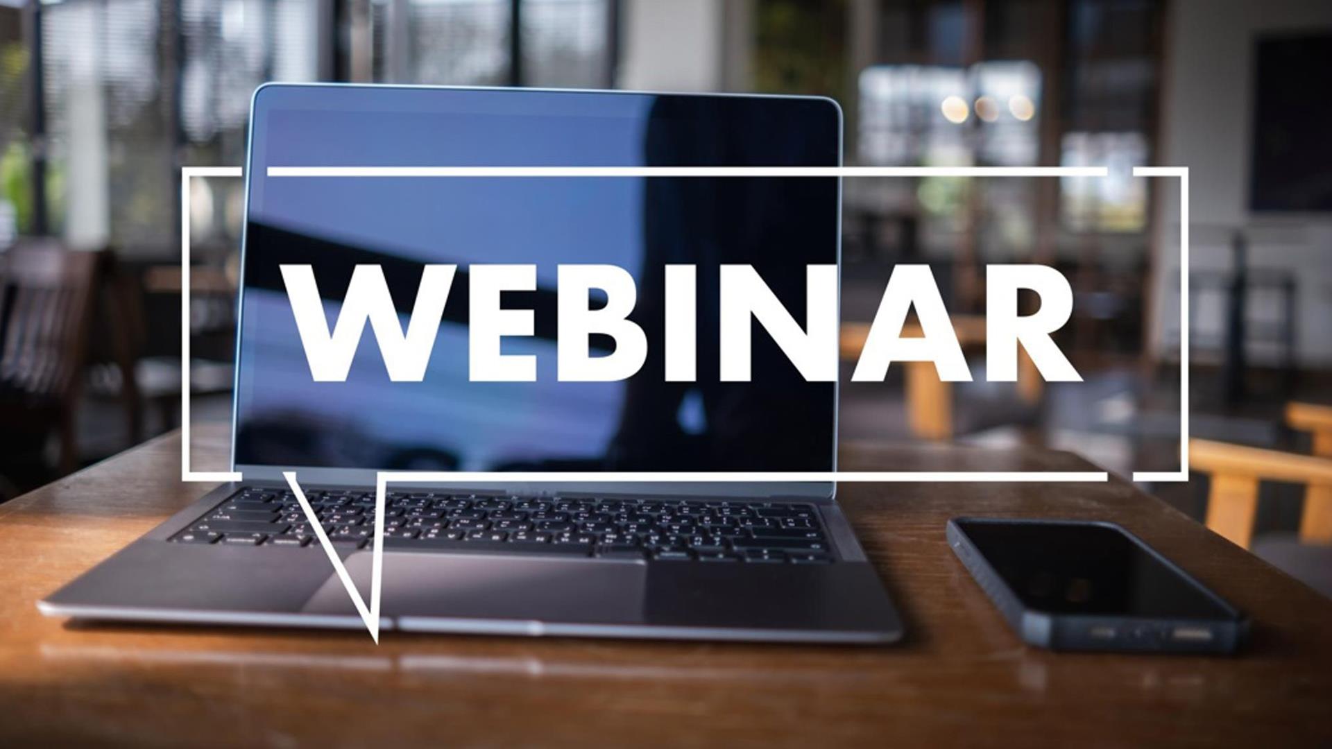 Image of computer with text overlaying saying "webinar"