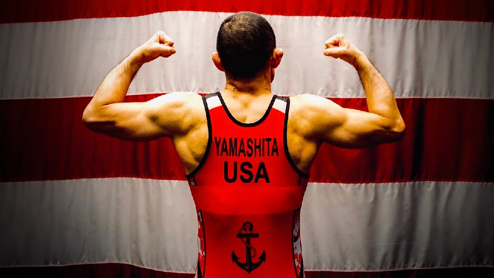 Master-at-Arms First Class (MA1) Robert Yamashita posing in his wrestling uniform