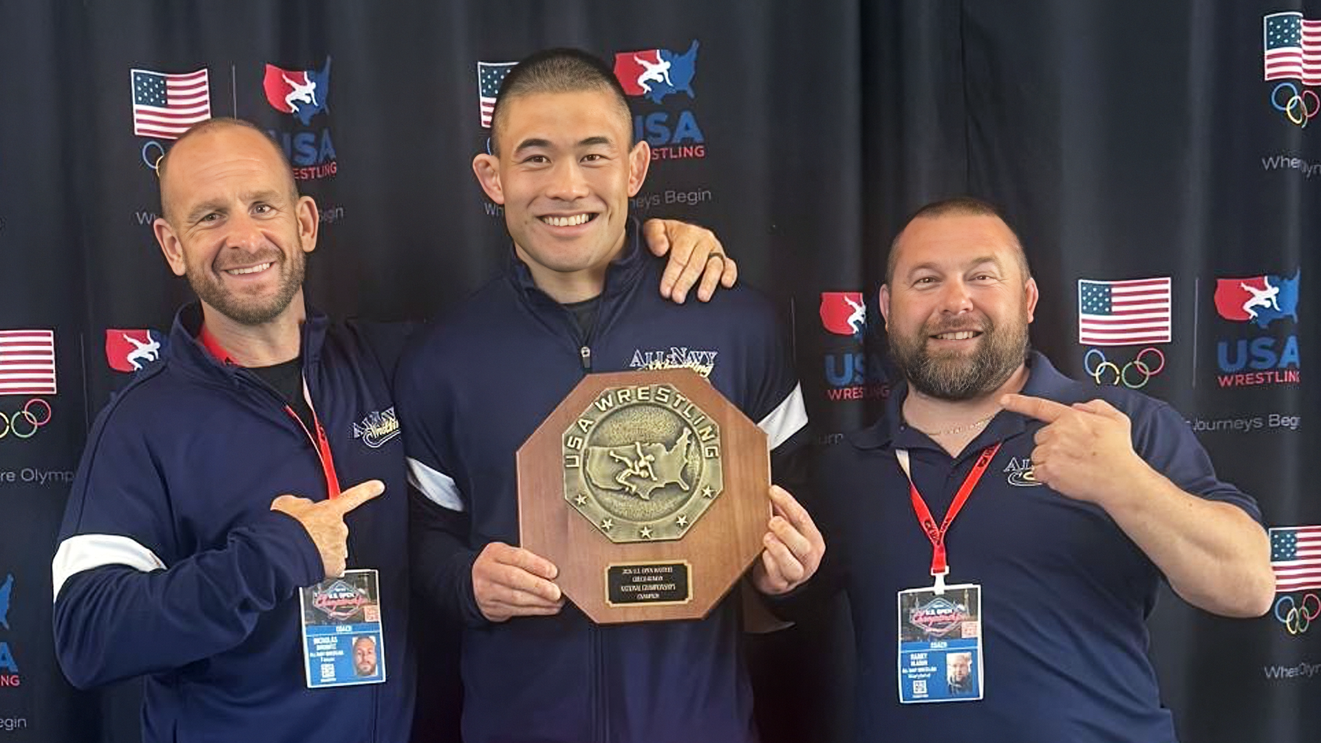 MA1 Robert Yamashita holding his gold medal