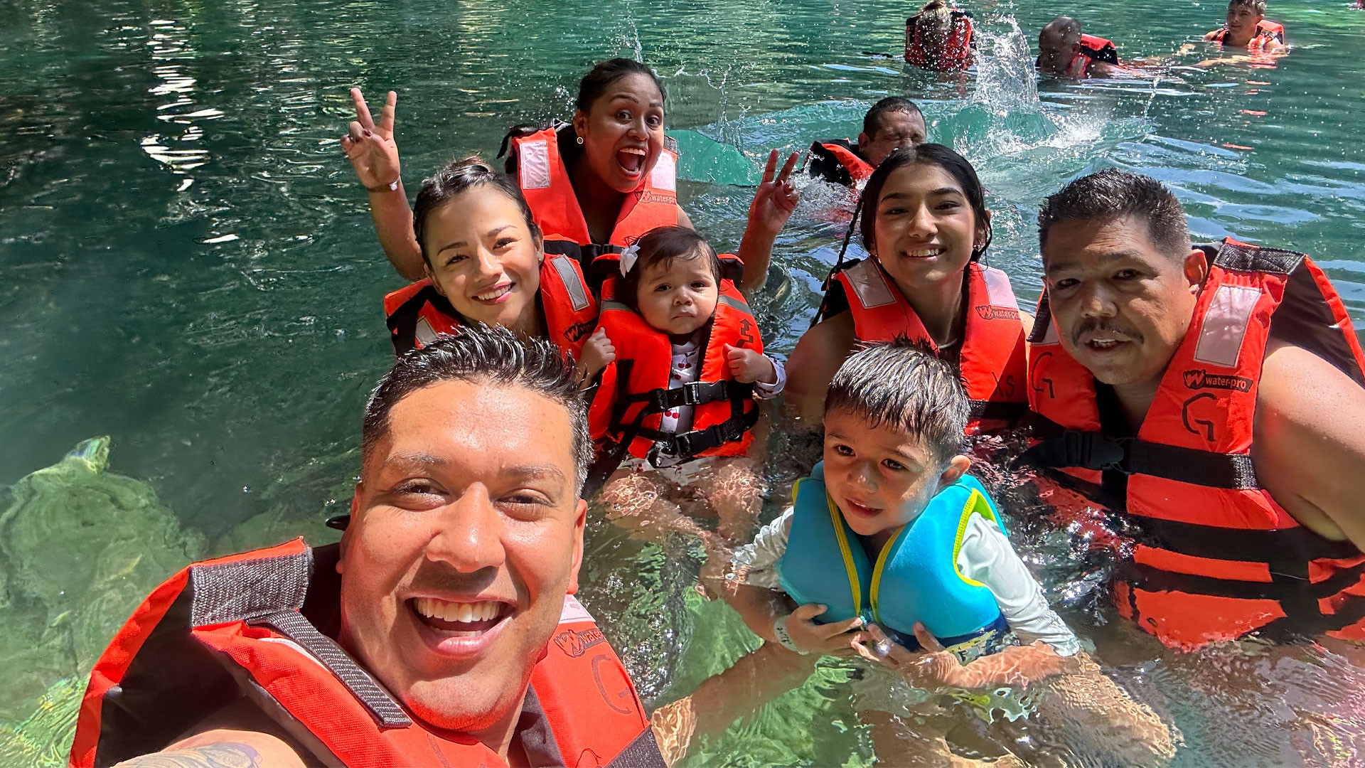 Family swimming in water