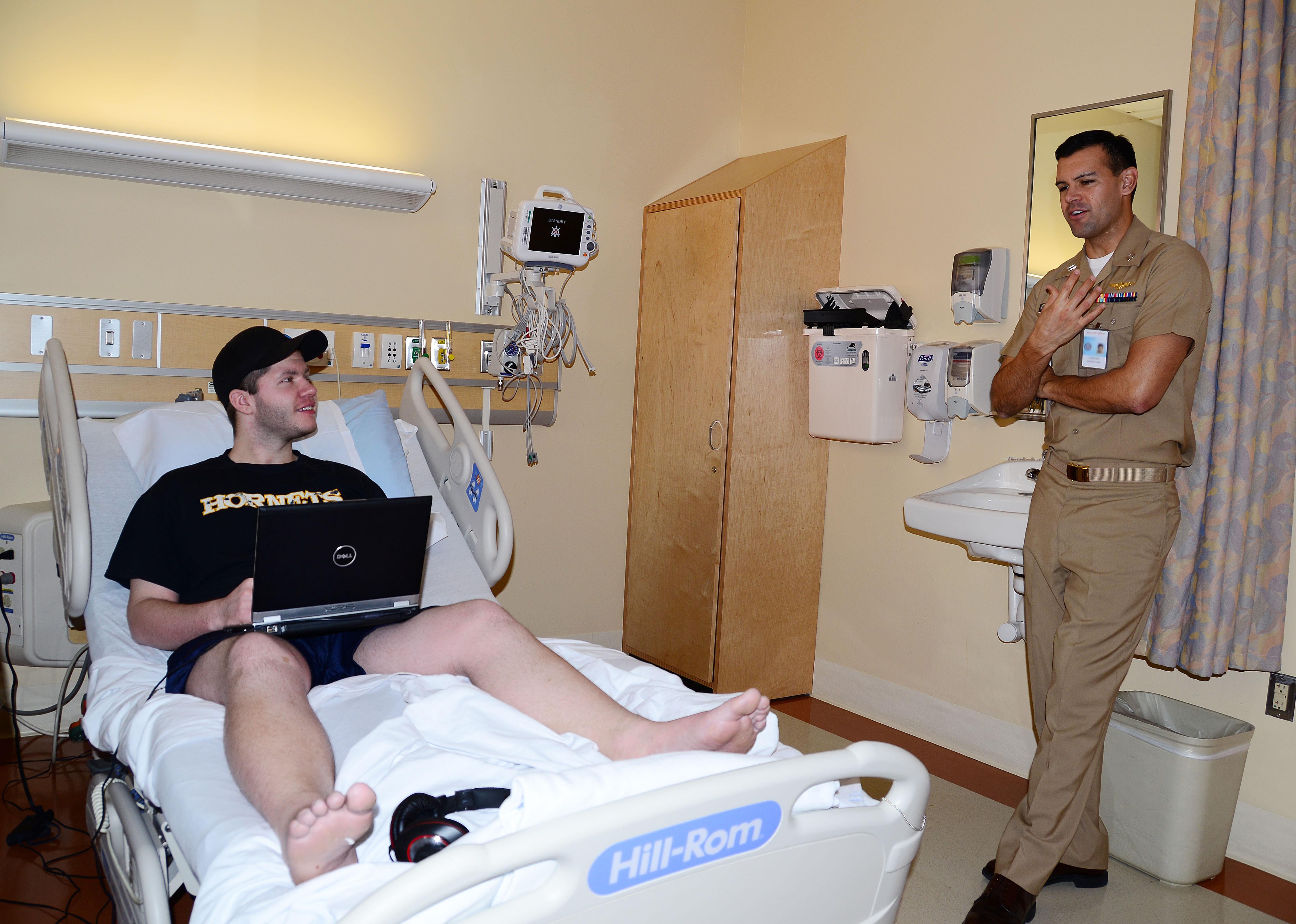 Navy Wounded Warrior in hospital bed